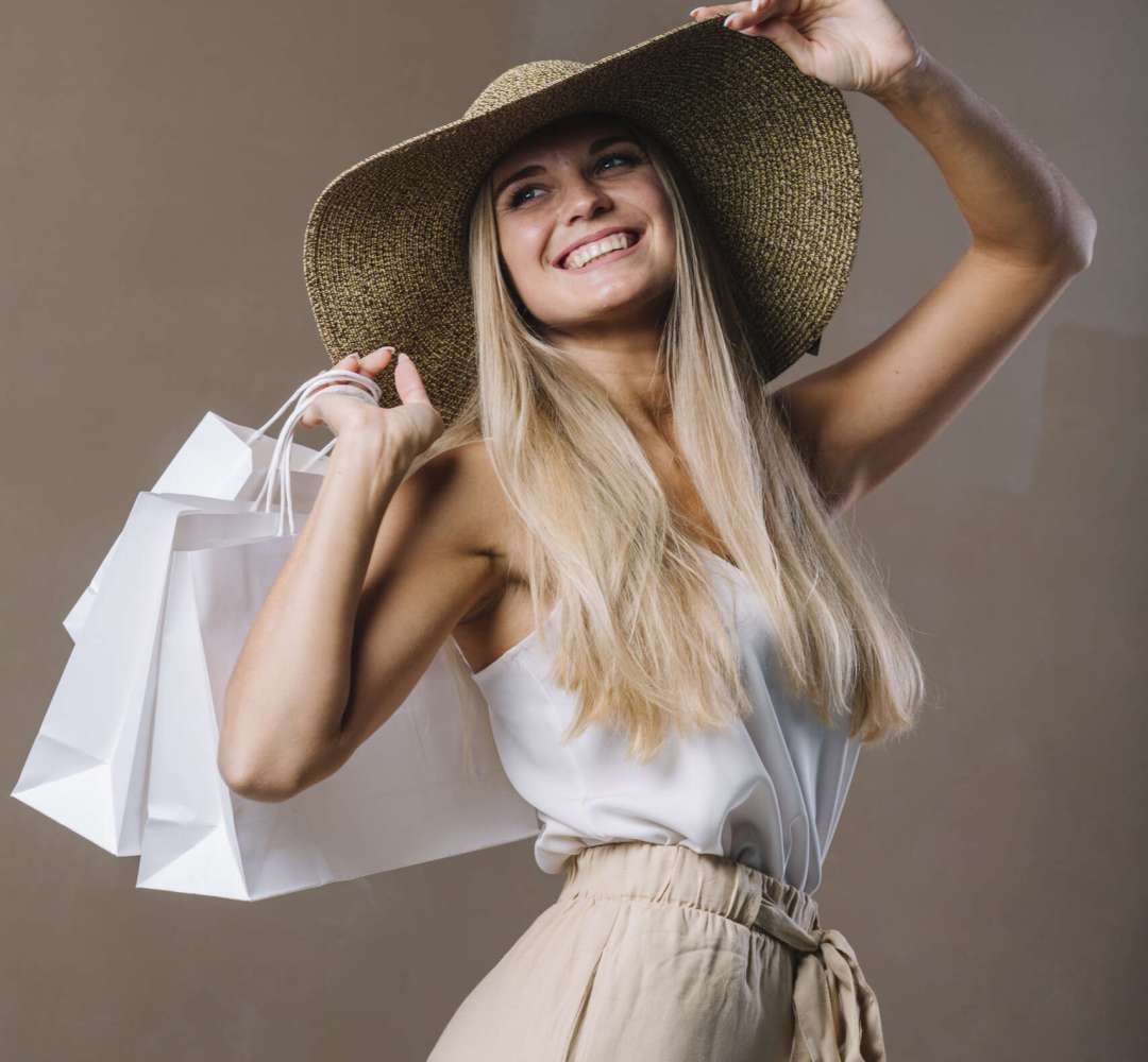 beautiful-young-woman-holding-shopping-bags